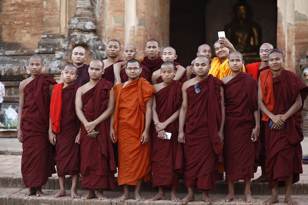 monks taking group photos by the temple of Bagan, Myanmar, portraits of Burma 缅甸